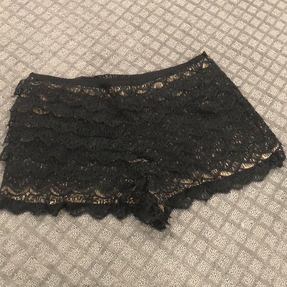 Haute Hippie Black lace shorts with tan lining.